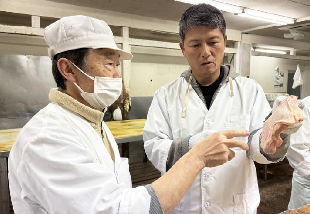 Isao carefully selecting and inspecting chicken ingredients in Kobe, Japan
