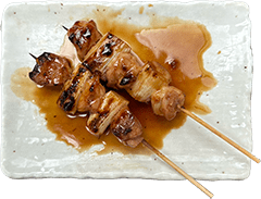 Negima yakitori skewers with chicken and green onion in Kobe, Japan